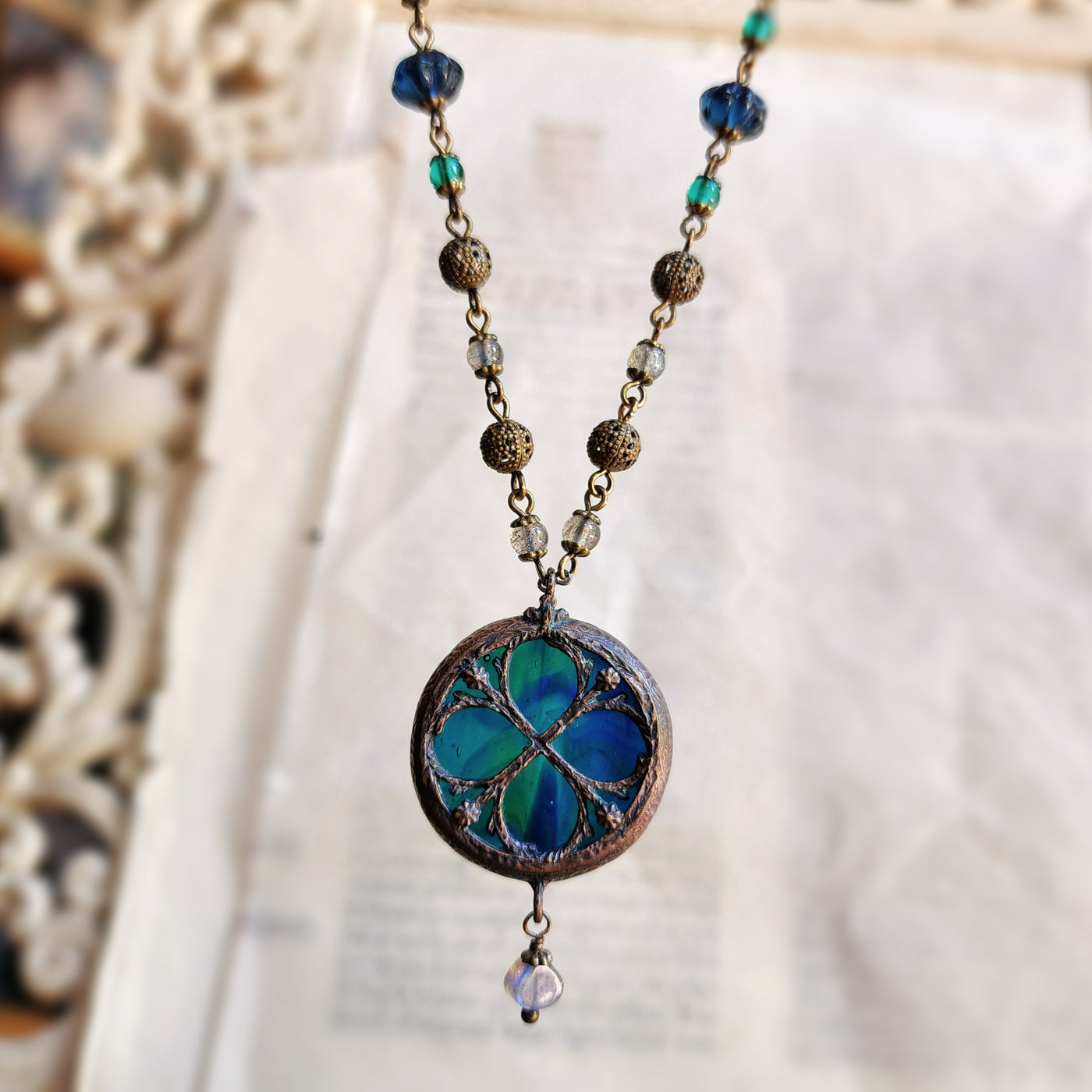 depths of the sea - floriated clover miracle window amulet