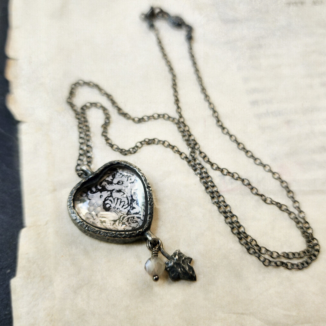 beasties & birds - pictorial heart amulet