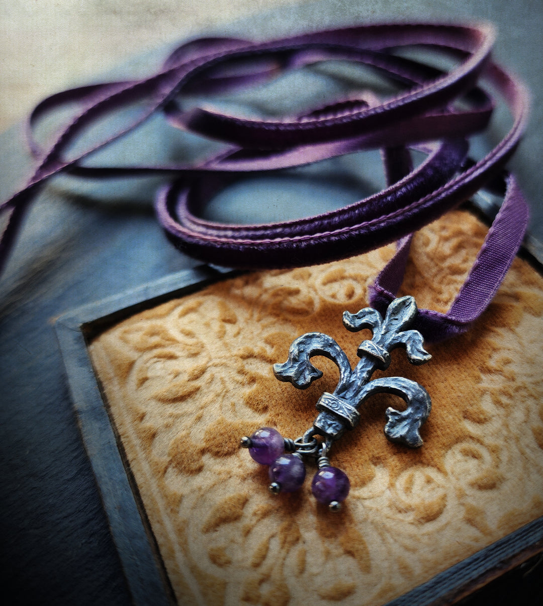 fleur de lis amulet - antiqued sterling on velvet