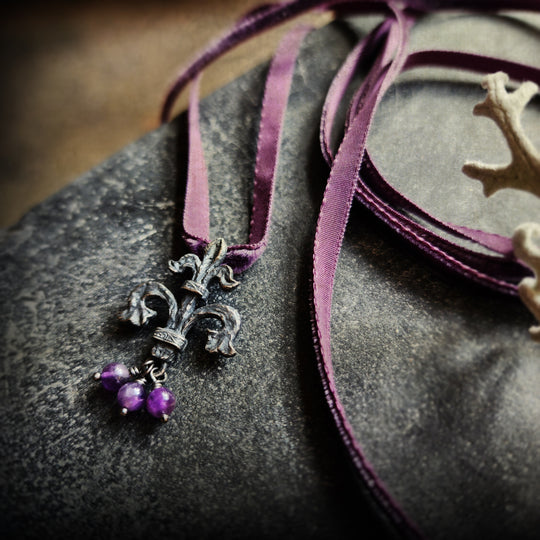 fleur de lis amulet - antiqued sterling on velvet