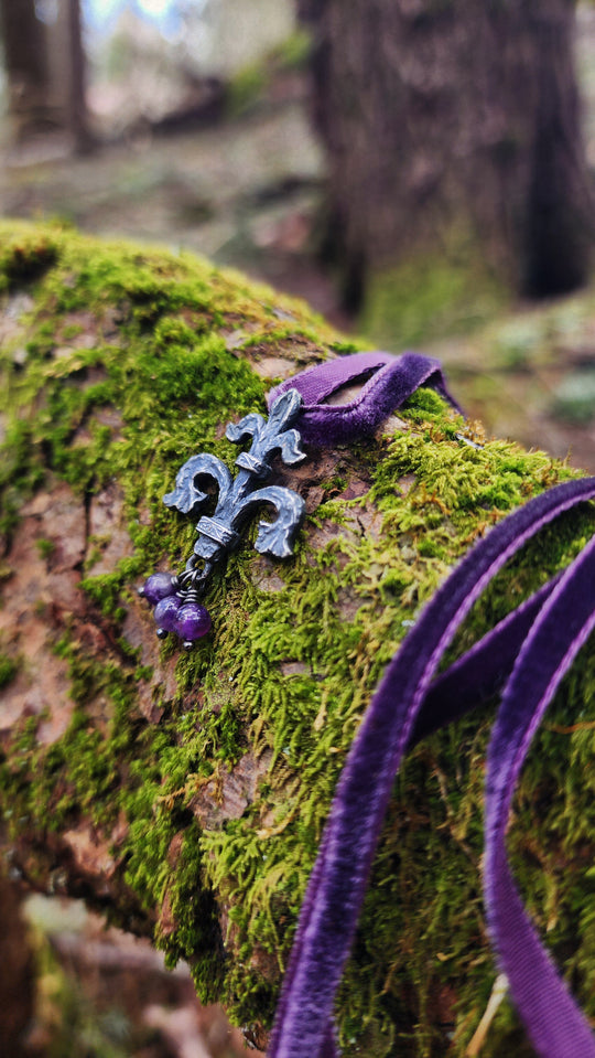 fleur de lis amulet - antiqued sterling on velvet
