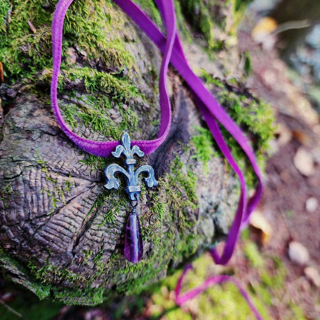 fleur de lis amulet - antiqued sterling with fluorite on velvet