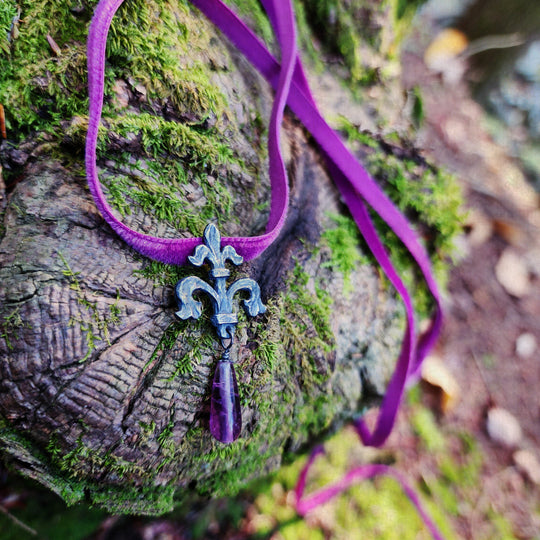 fleur de lis amulet - antiqued sterling with fluorite on velvet