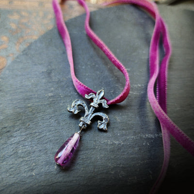 fleur de lis amulet - antiqued sterling with fluorite on velvet