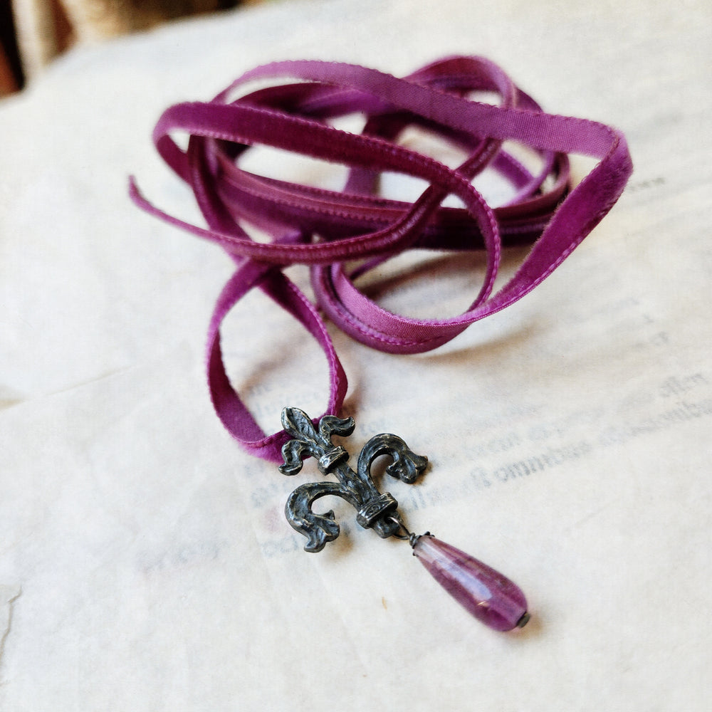 fleur de lis amulet - antiqued sterling with fluorite on velvet