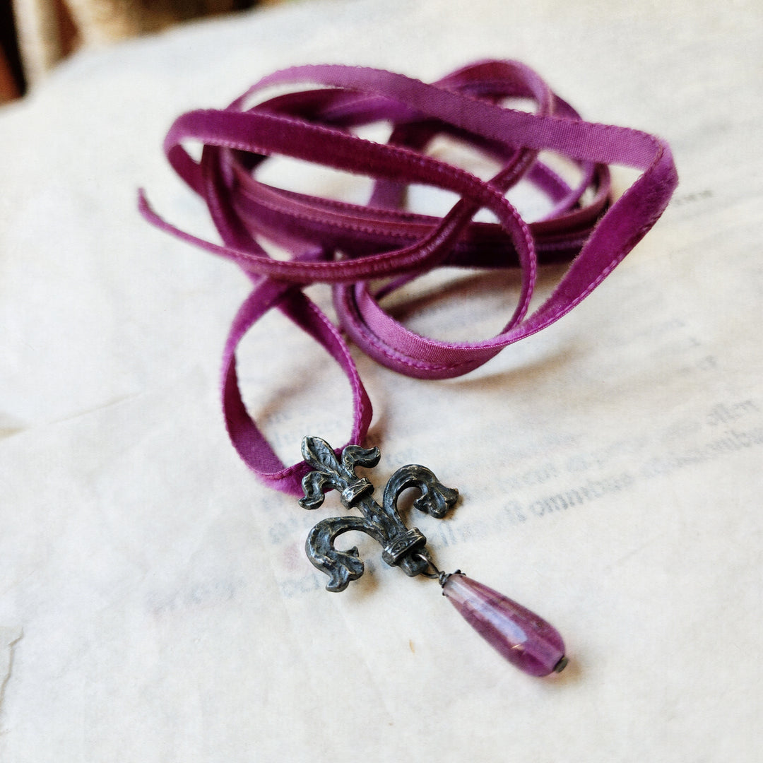 fleur de lis amulet - antiqued sterling with fluorite on velvet