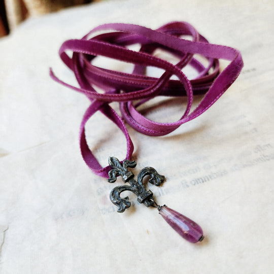 fleur de lis amulet - antiqued sterling with fluorite on velvet
