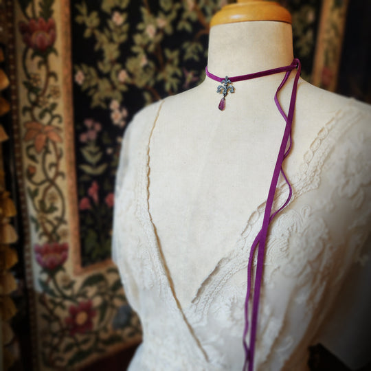 fleur de lis amulet - antiqued sterling with fluorite on velvet