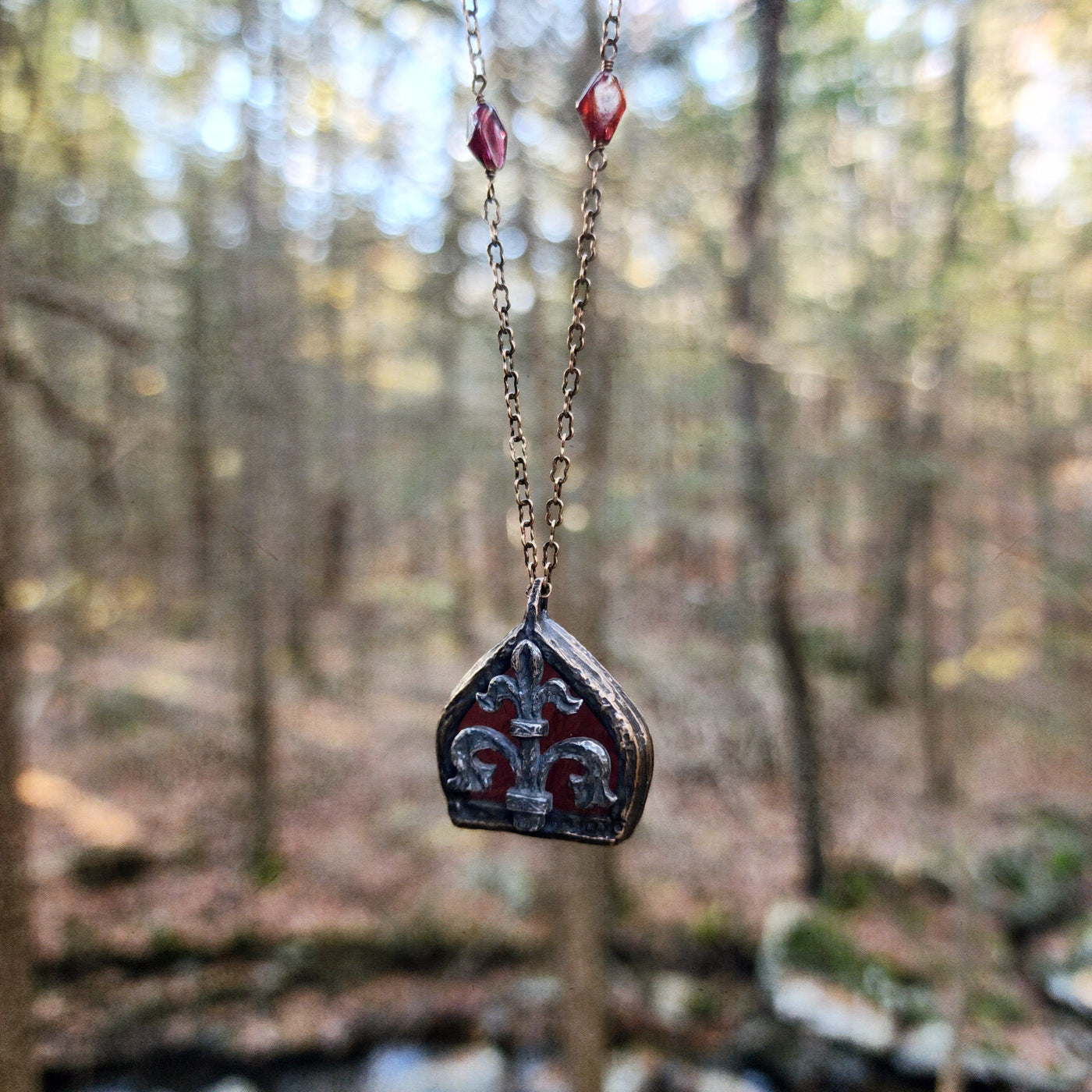 fleur de lis - garnet arch window amulet - antiqued sterling & bronze