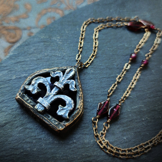 fleur de lis - garnet arch window amulet - antiqued sterling & bronze