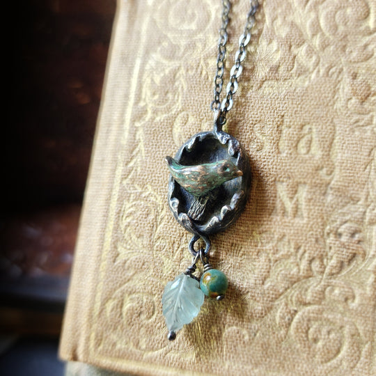 hope is the thing with feathers amulet