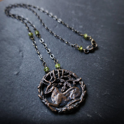 hart of the oak bower amulet - bronze & faceted peridot