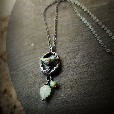hope is the thing with feathers amulet