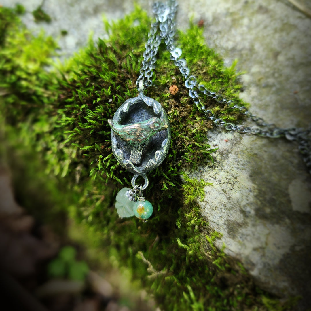 hope is the thing with feathers amulet