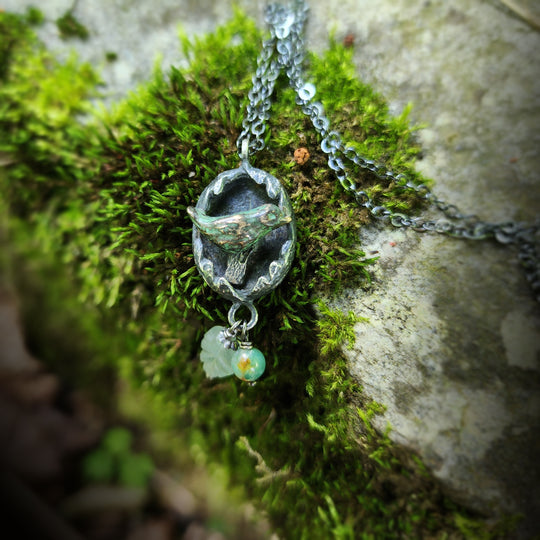 hope is the thing with feathers amulet