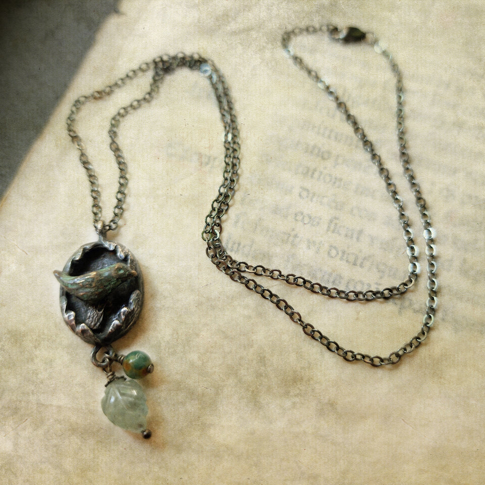 hope is the thing with feathers amulet