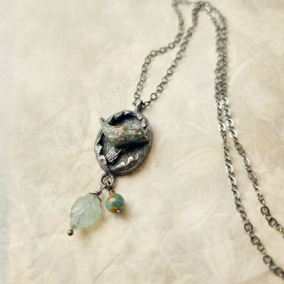 hope is the thing with feathers amulet