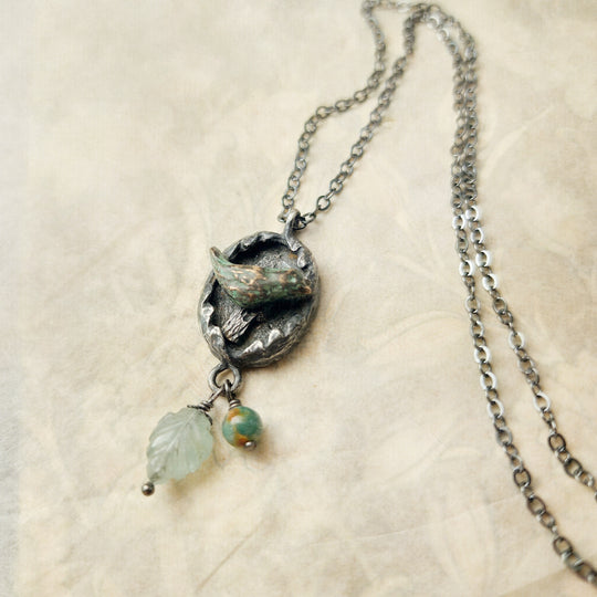 hope is the thing with feathers amulet