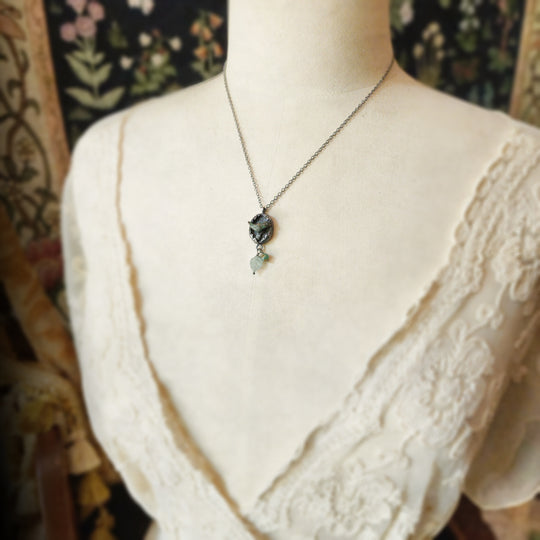 hope is the thing with feathers amulet