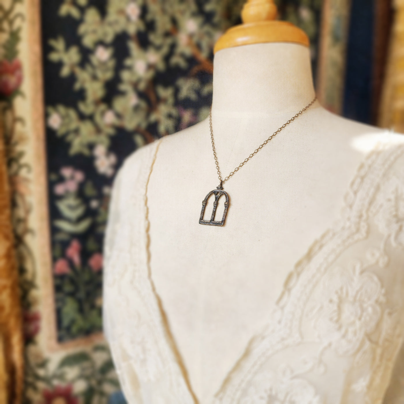 crowned queen isabella window amulet - antiqued bronze