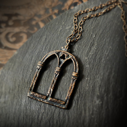 crowned queen isabella window amulet - antiqued bronze