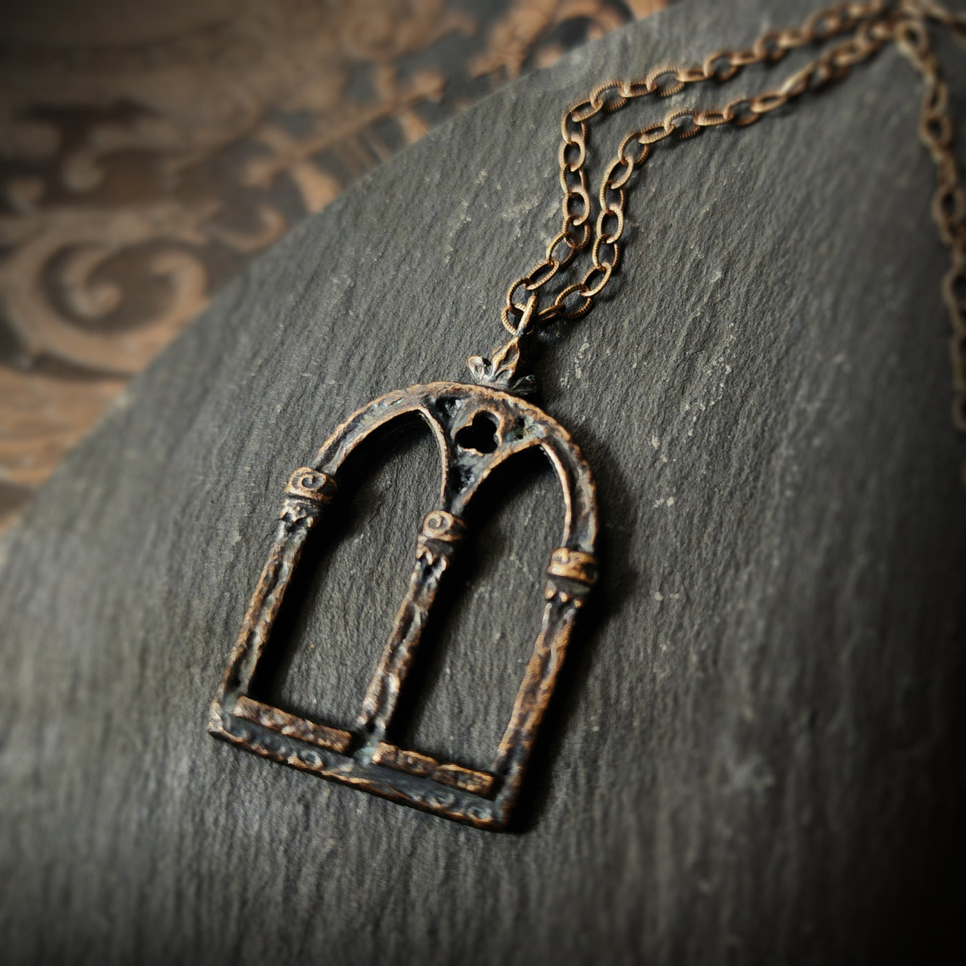 crowned queen isabella window amulet - antiqued bronze