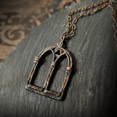 crowned queen isabella window amulet - antiqued bronze