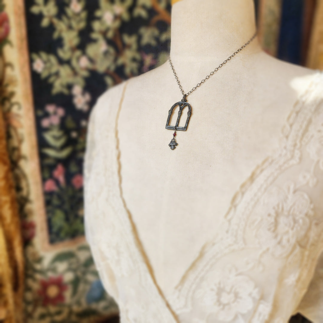 crowned queen isabella window amulet with fleur - garnet & antiqued sterling