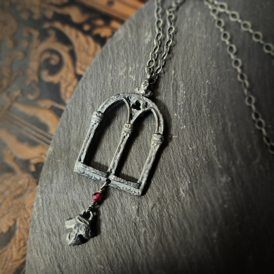 crowned queen isabella window amulet with fleur - garnet & antiqued sterling