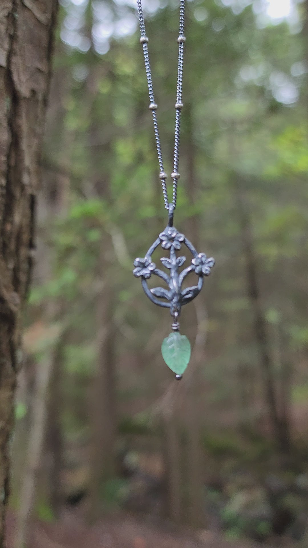 trois fleurs sacrées amulet - antiqued sterling with aventurine leaf