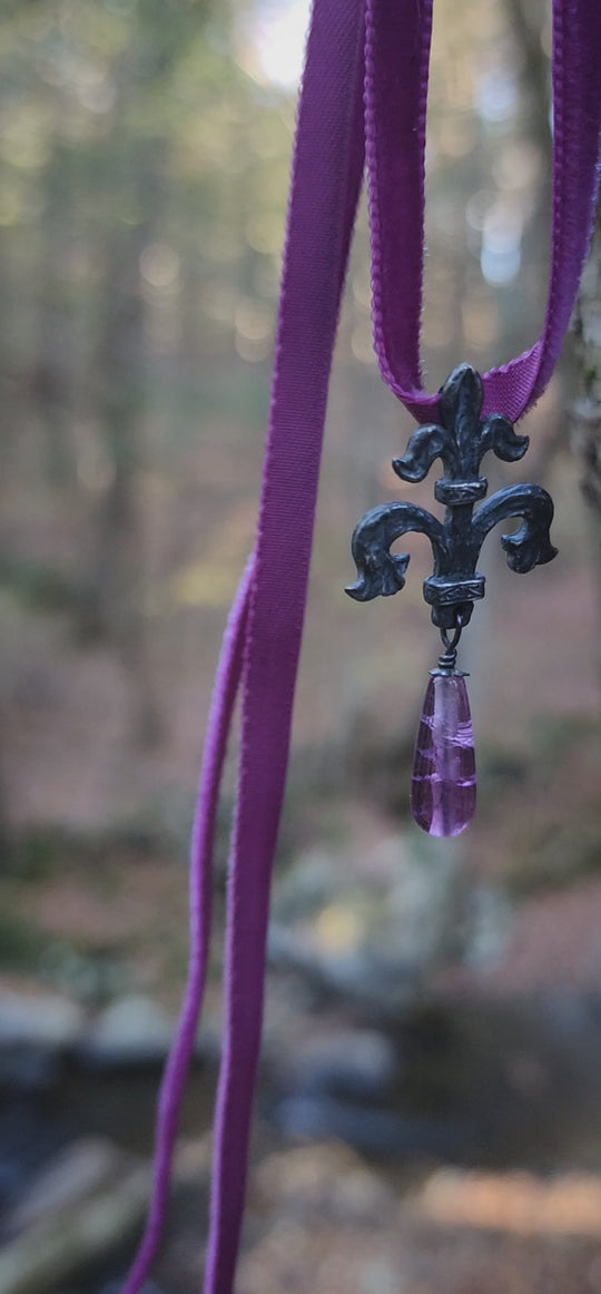 fleur de lis amulet - antiqued sterling with fluorite on velvet