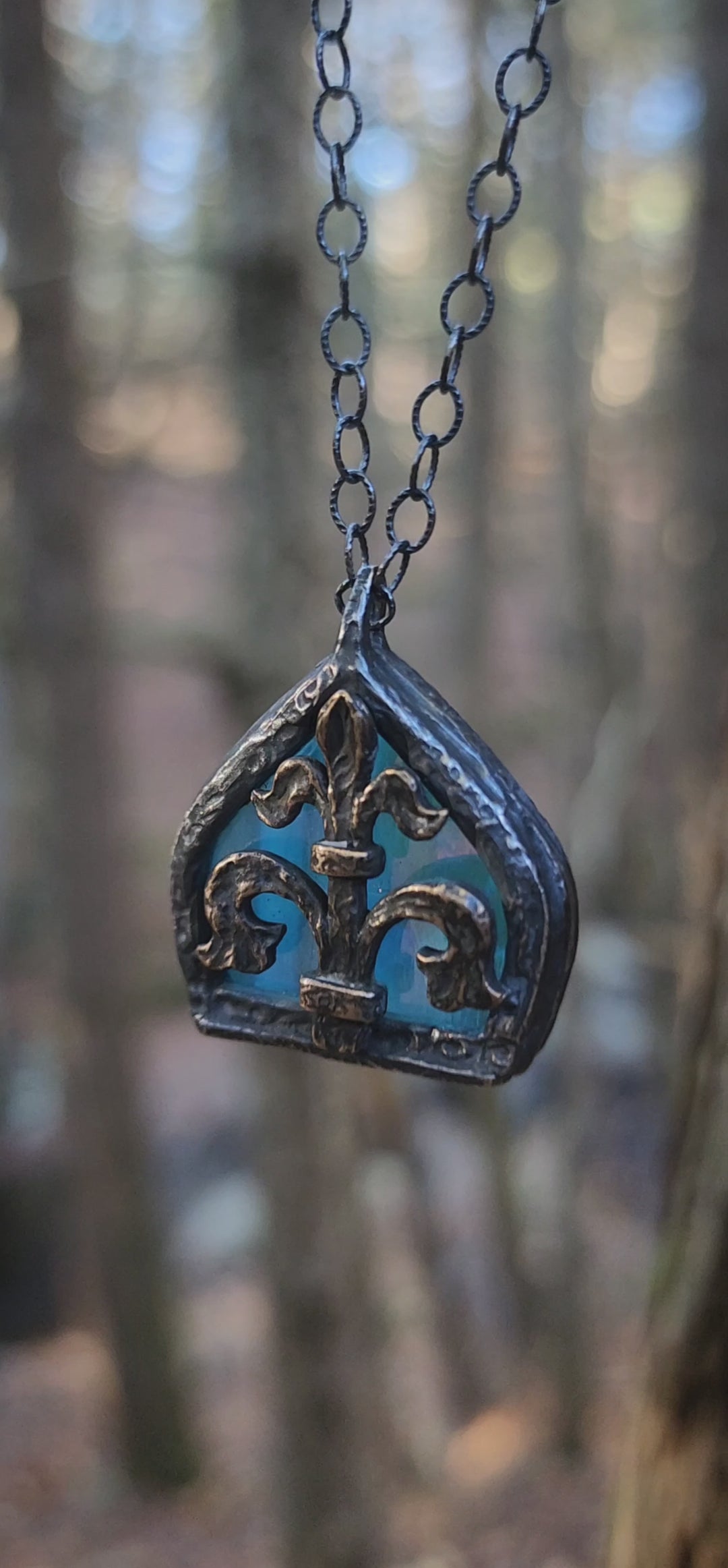 fleur de lis - iridescent aqua arch window amulet - antiqued sterling & bronze