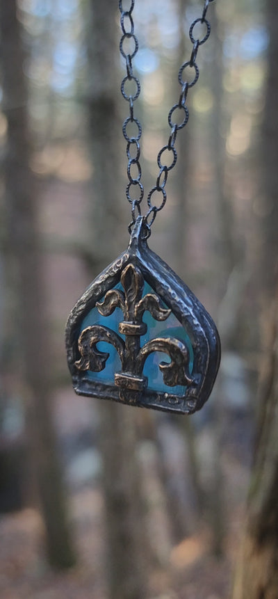 fleur de lis - iridescent aqua arch window amulet - antiqued sterling & bronze