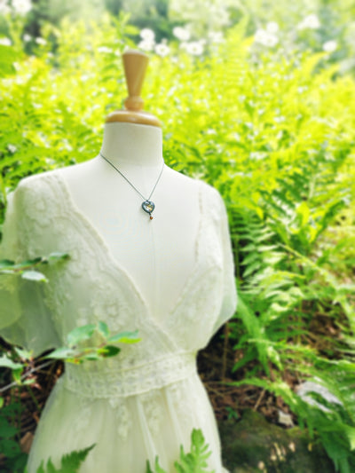 psyche entering cupid's garden - pictorial heart amulet