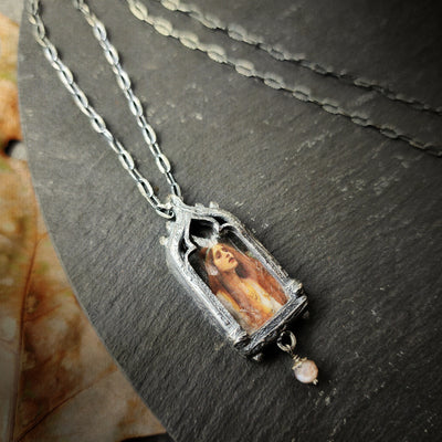 the broad stream bore her far away - venetian gothic window amulet