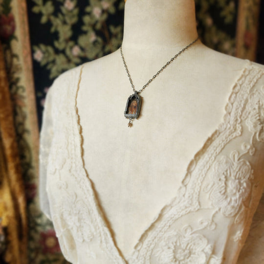 the broad stream bore her far away - venetian gothic window amulet