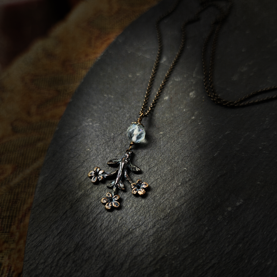 trois fleurs sacrées amulet - antiqued bronze with fluorite