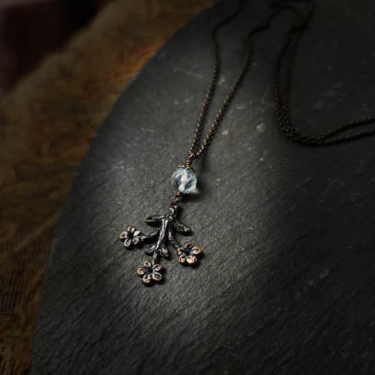 trois fleurs sacrées amulet - antiqued bronze with fluorite