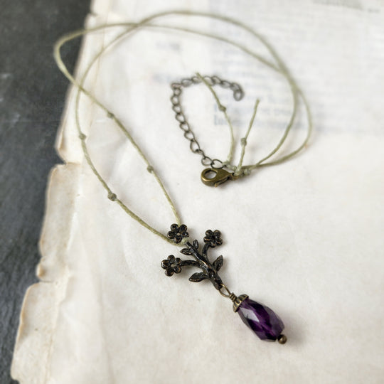 trois fleurs sacrées amulet - antiqued bronze with amethyst