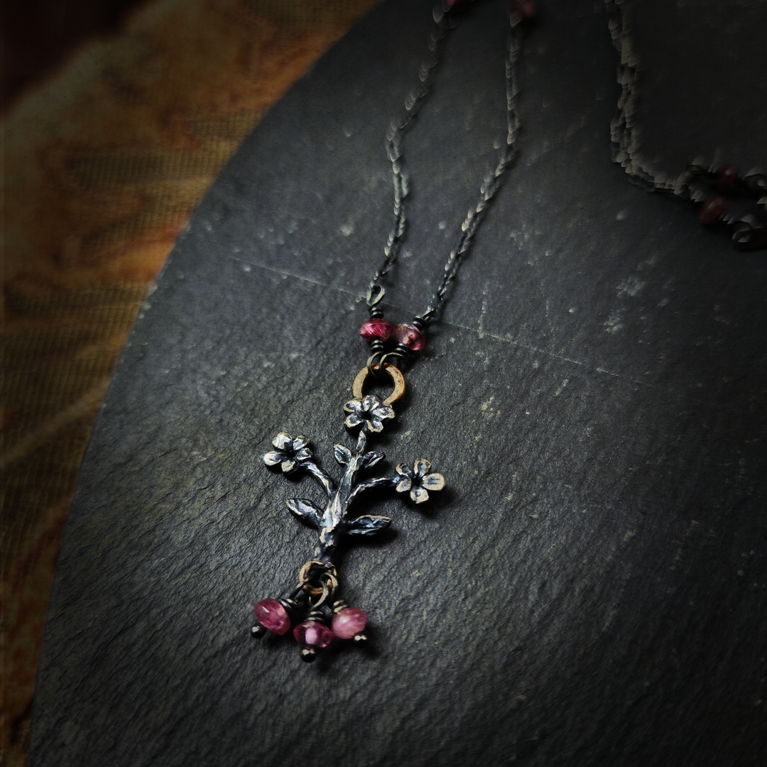 trois fleurs sacrées amulet - antiqued sterling & bronze with tourmaline