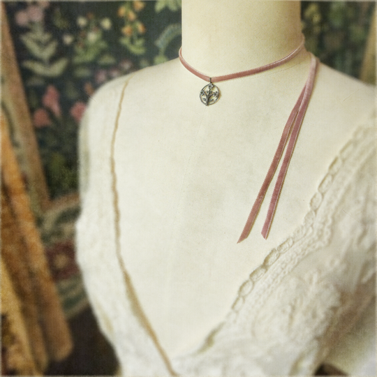 trois fleurs sacrées amulet - antiqued sterling on velvet ribbon