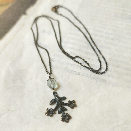trois fleurs sacrées amulet - antiqued bronze with fluorite