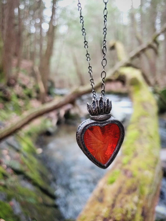 peace arrives as a hummingbird - a sacred heart amulet
