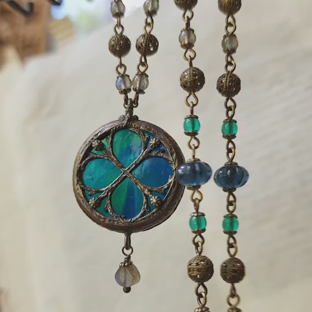 depths of the sea - floriated clover miracle window amulet