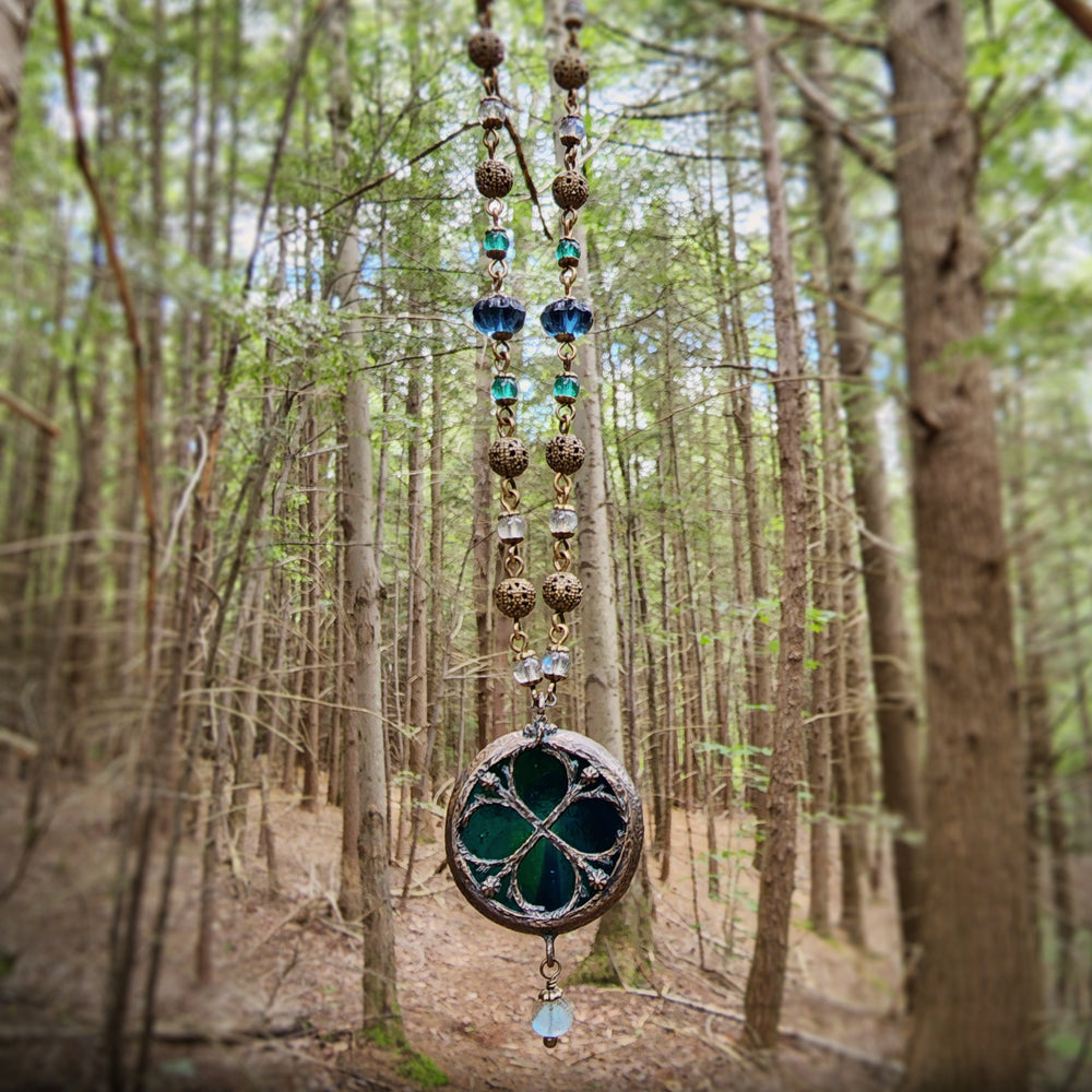 depths of the sea - floriated clover miracle window amulet