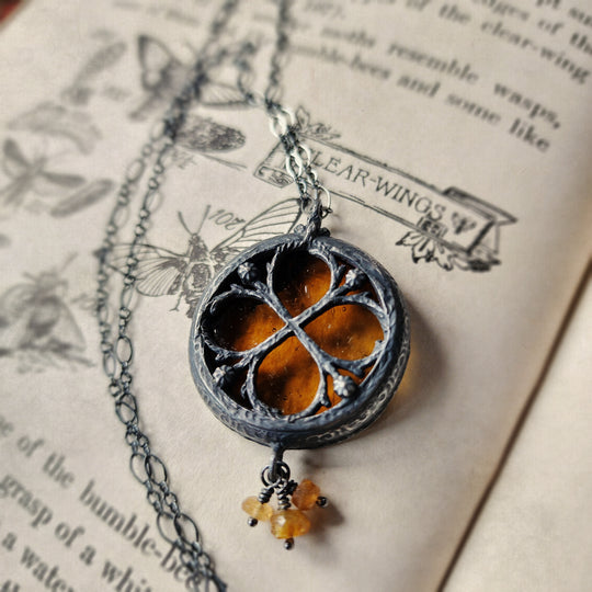 the infinity of the hive - floriated clover miracle window amulet