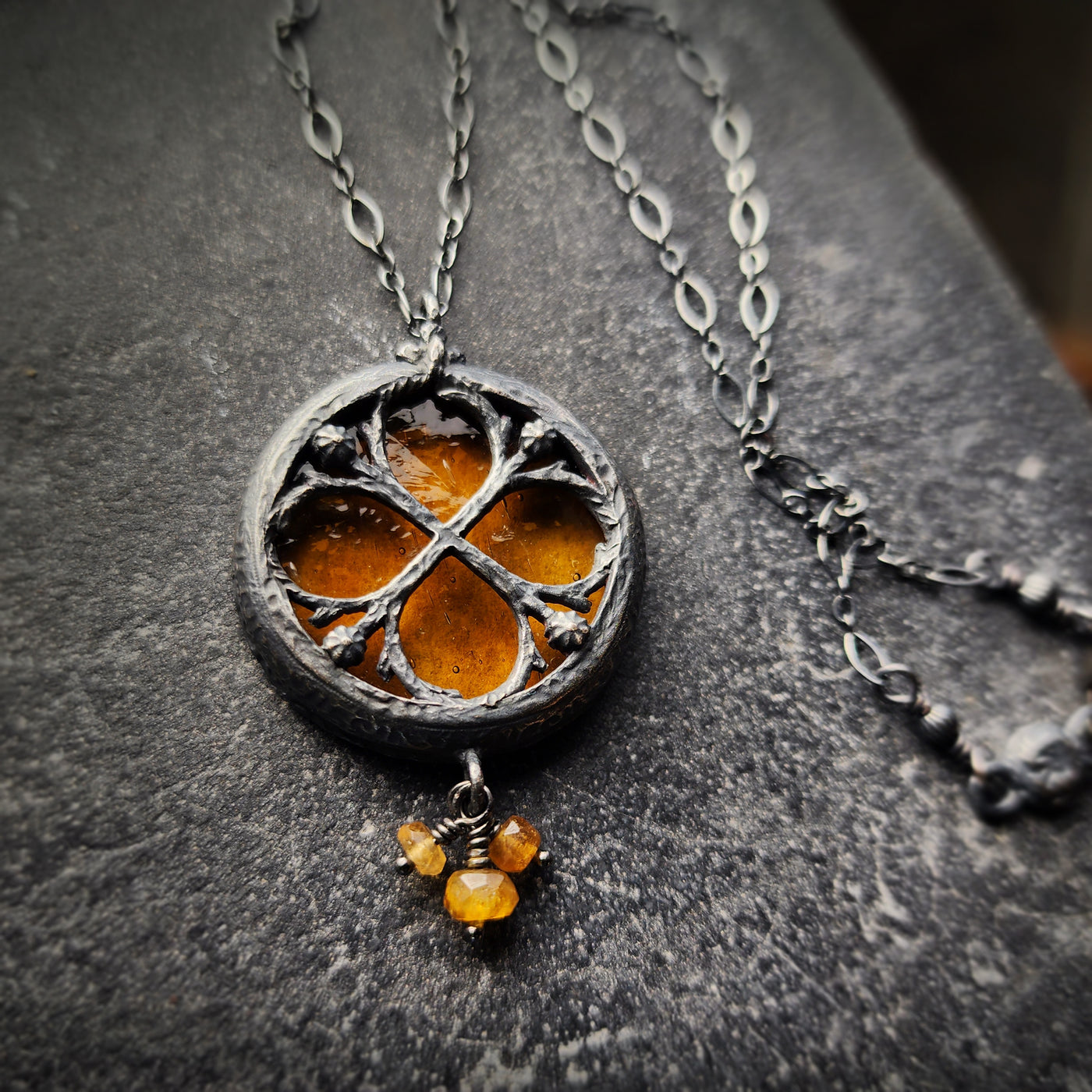 the infinity of the hive - floriated clover miracle window amulet