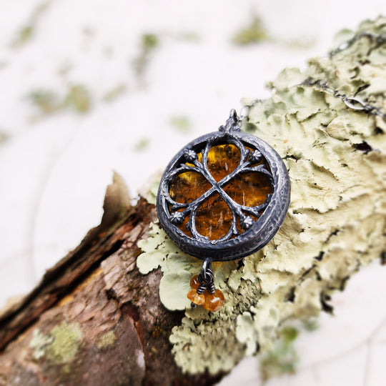 the infinity of the hive - floriated clover miracle window amulet